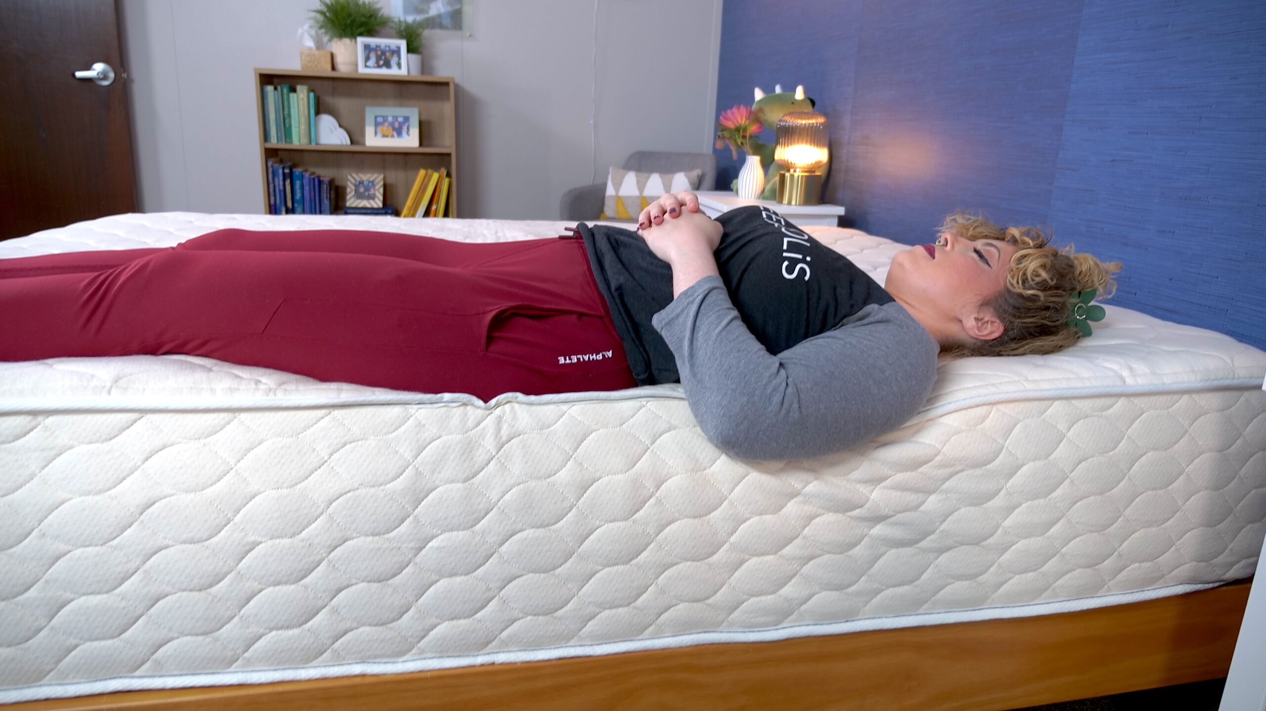 Nichole testing the edge support on the WinkBeds EcoCloud Hybrid Mattress