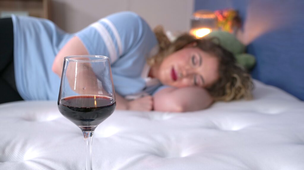 Nichole doing the wine test on the WinkBed